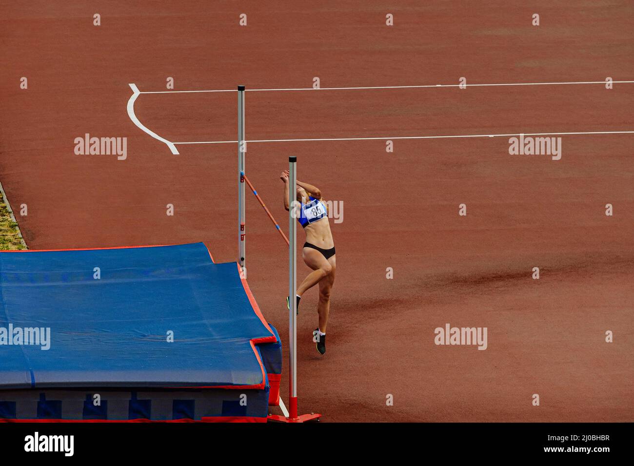 high jump female athlete in athletics competition Stock Photo