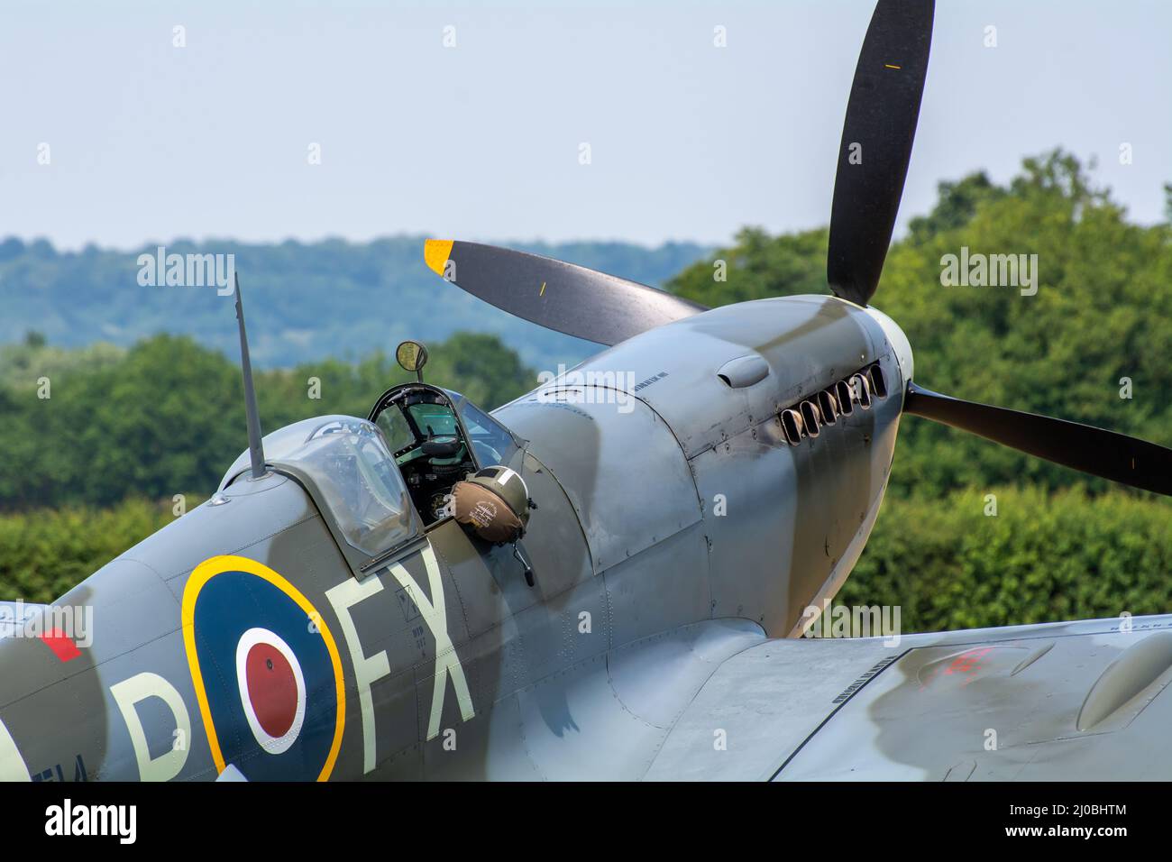 Headcorn, Kent  UK - July 1st 2018 Royal Air Force ground crew do pre-flight checks and prepare a group of spitfire WW2 fighter planes for takeoff. Stock Photo