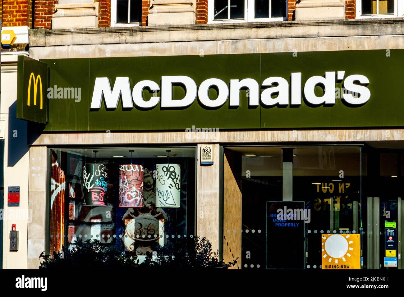 Epsom Surrey London UK, March 17 2022, McDonalds Fast Food Restaurant High Street Retail Chain Stock Photo