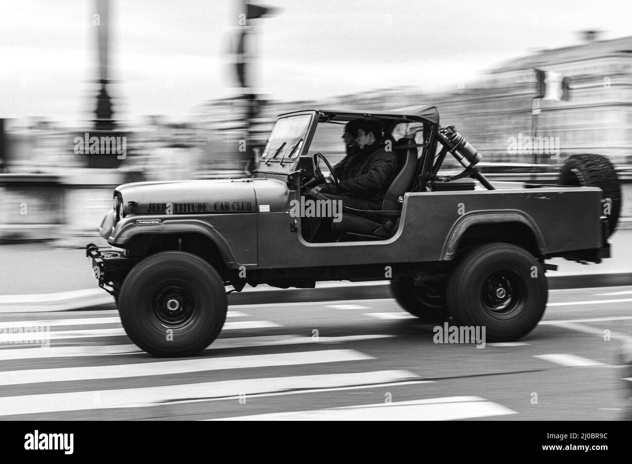 Old American off road truck on the city street with blurred background Stock Photo