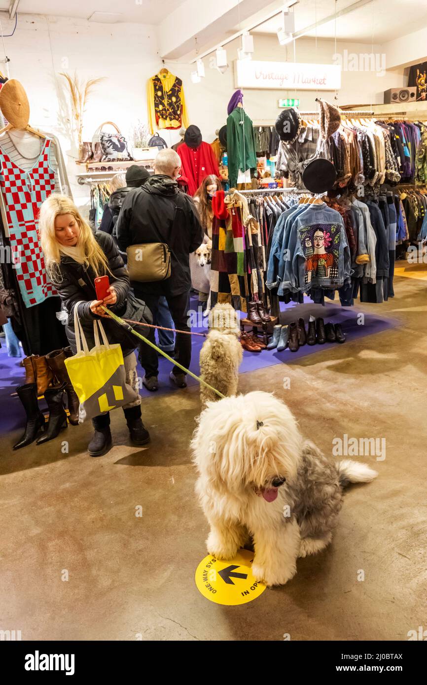 England, London, Shoreditch, Brick Lane, Woman Taking Picture of Pet