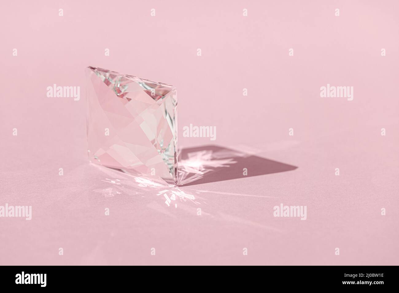 Crystal prism with light diffraction of spectrum colours and reflection