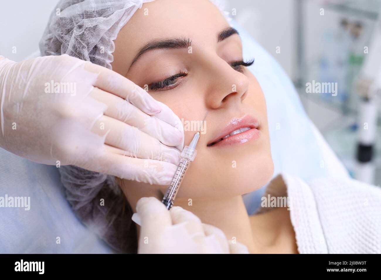 Rejuvenating facial injections. Stock Photo
