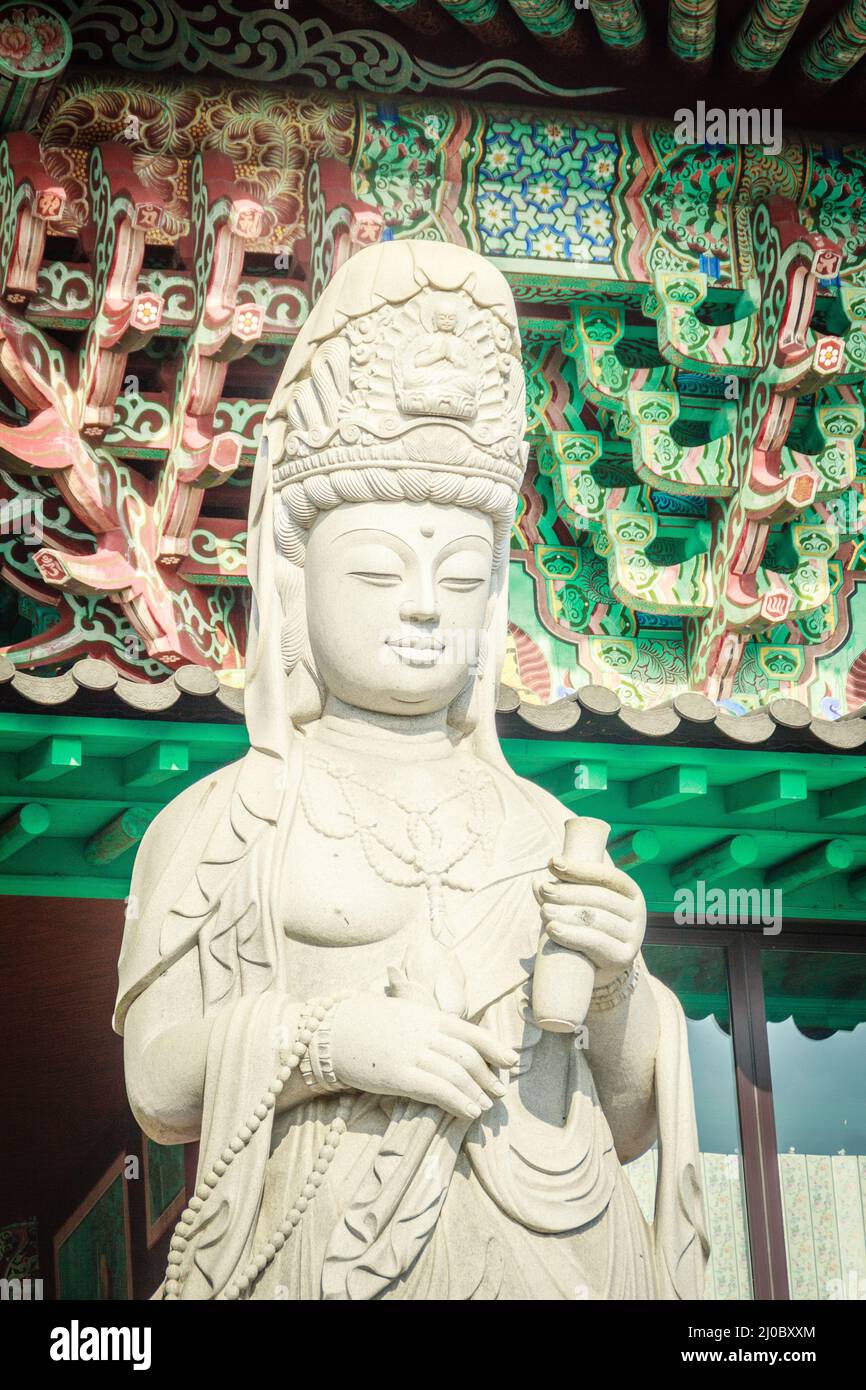 Stone statue of Gwanseeum-bosal at Sanbangsa Temple. Also known as Guanyin or Guanshiyin , is the Goddess of mercy, influenced f Stock Photo
