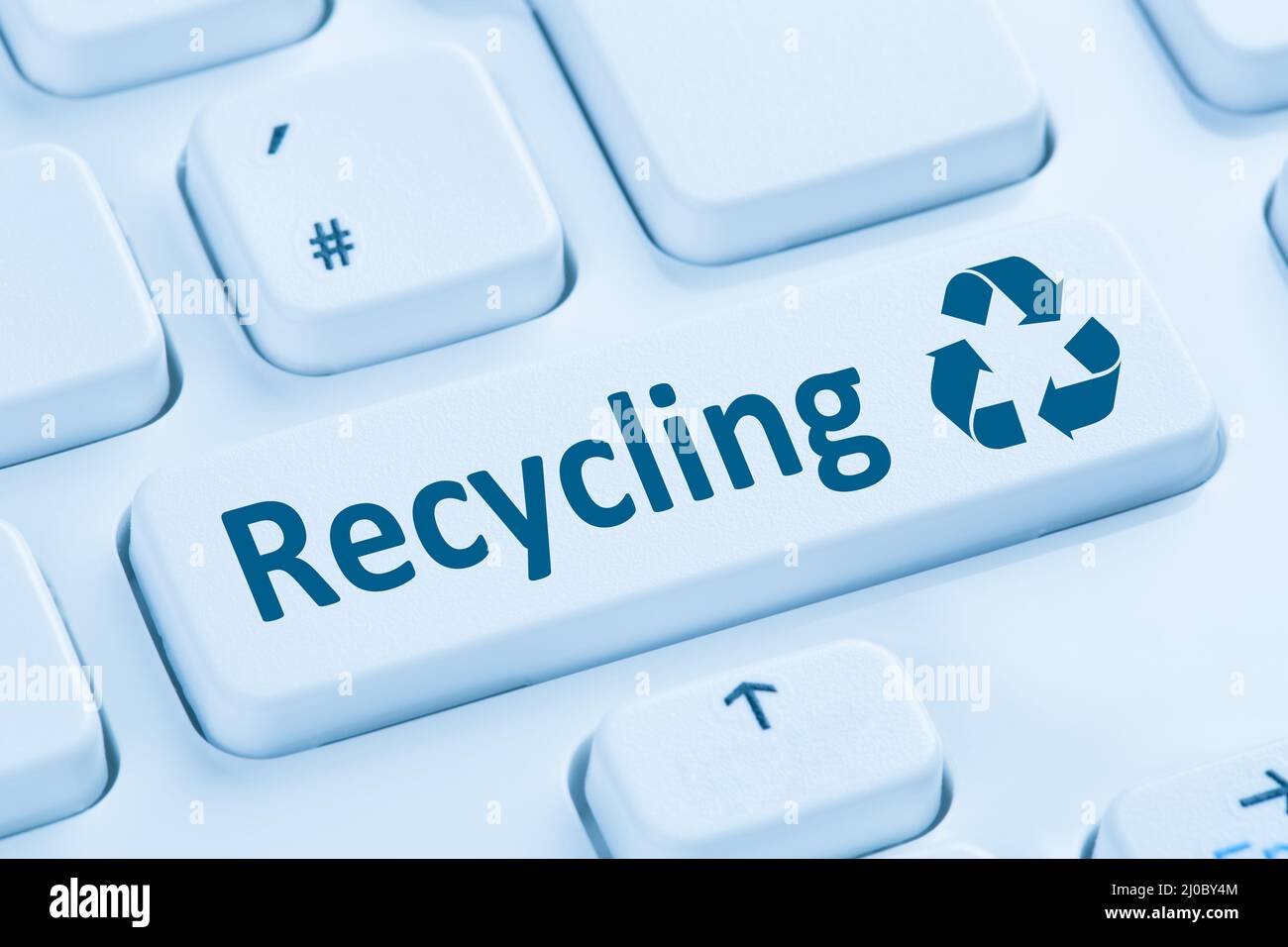 Recycling button environmental protection blue computer keyboard Stock Photo