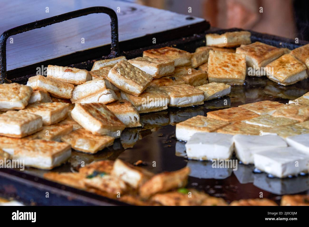 Golden tempting fried tofu on a food stand Stock Photo