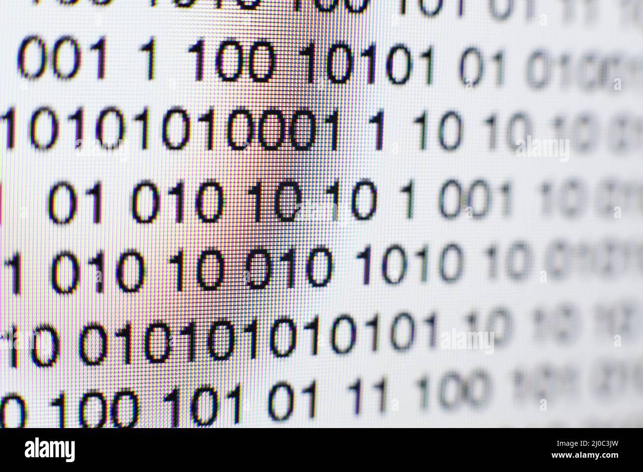 Binary code on a computer screen Stock Photo - Alamy