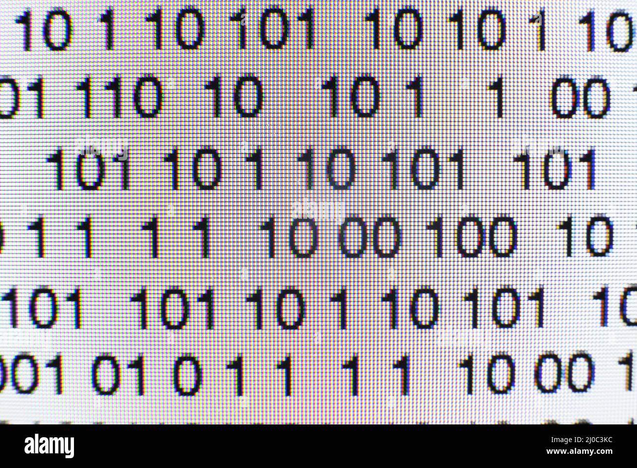 Binary code on a computer screen Stock Photo - Alamy