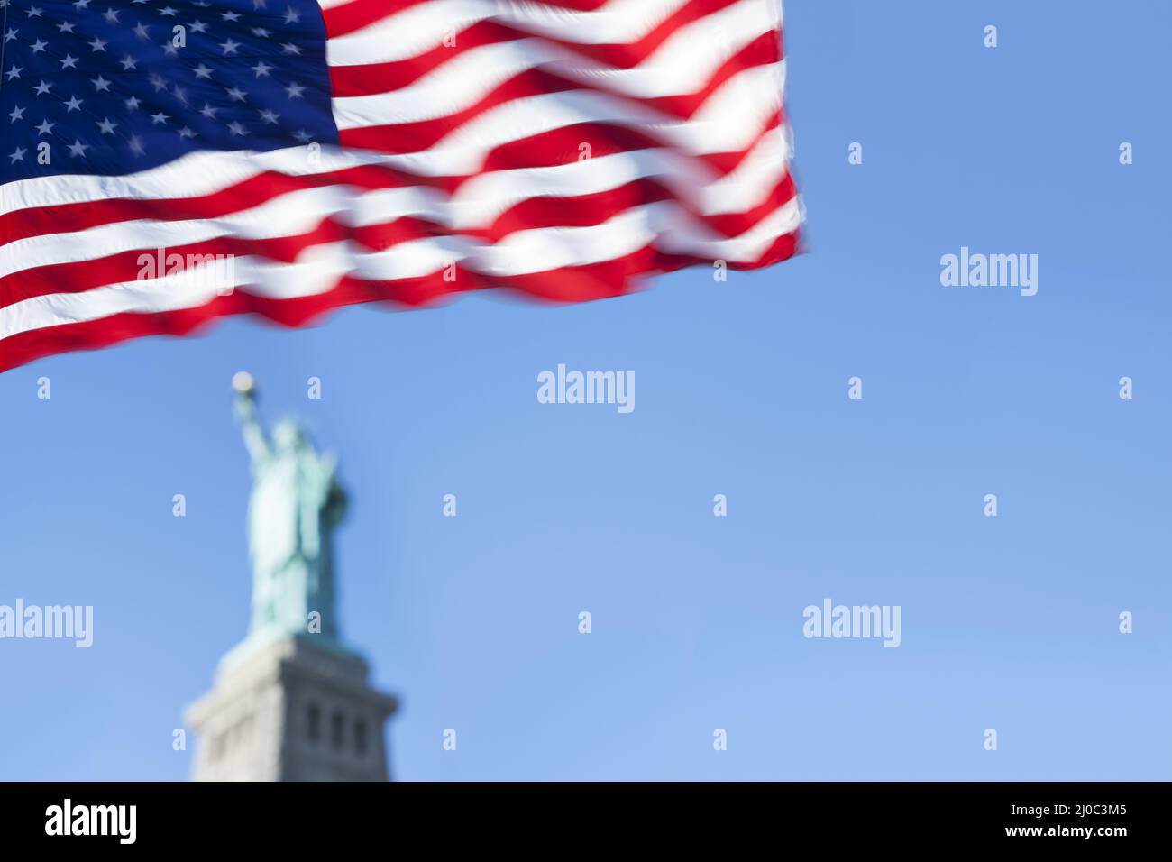 Statue of Liberty and the US Flag, New York City, New York, USA Stock