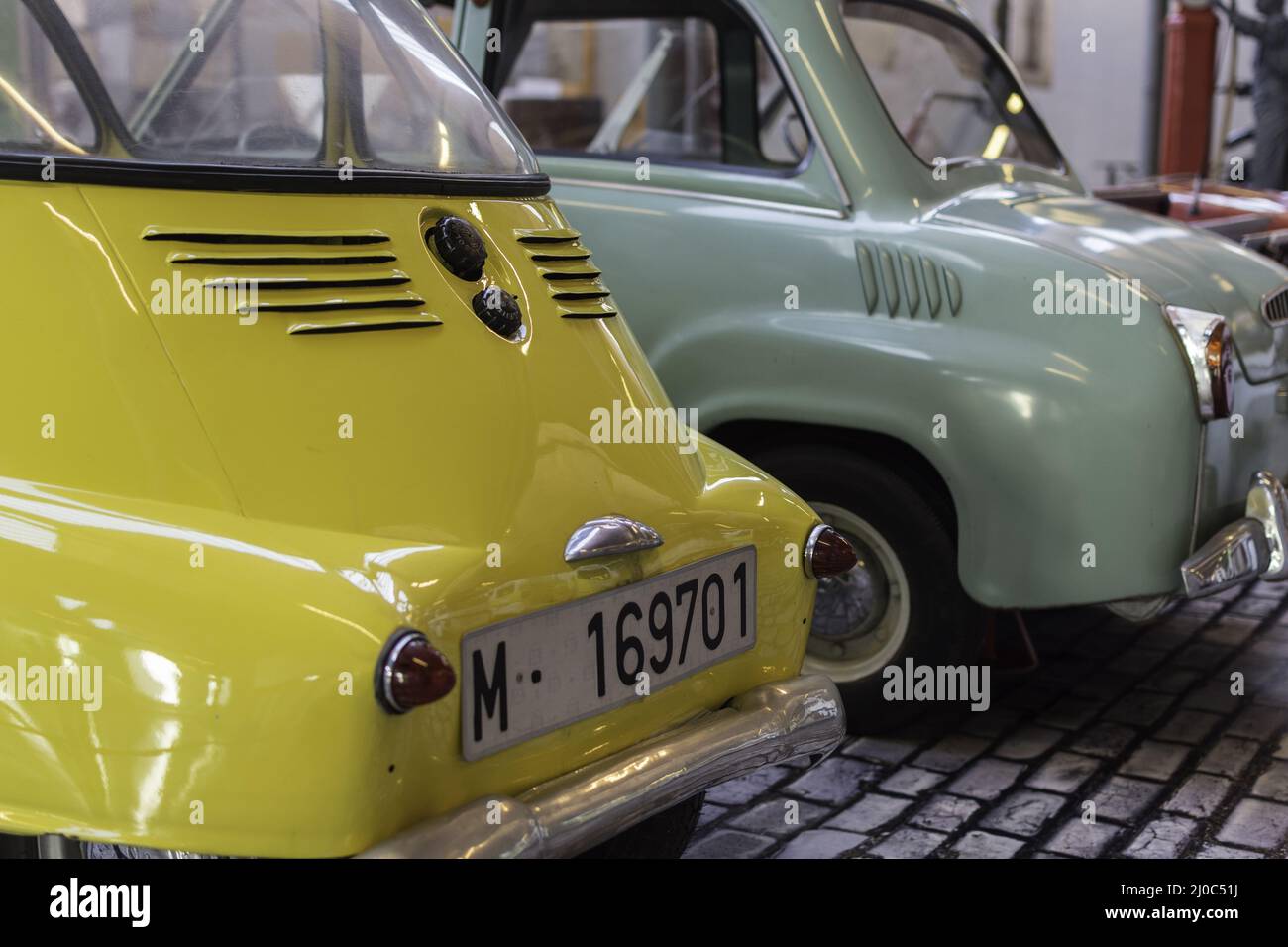 Iconic european car, yellow Isetta with one front door. Terrassa, Spain ...