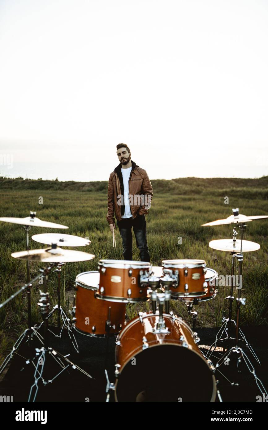 Caucasian drummer playing the drum in a field, Spain Stock Photo Alamy
