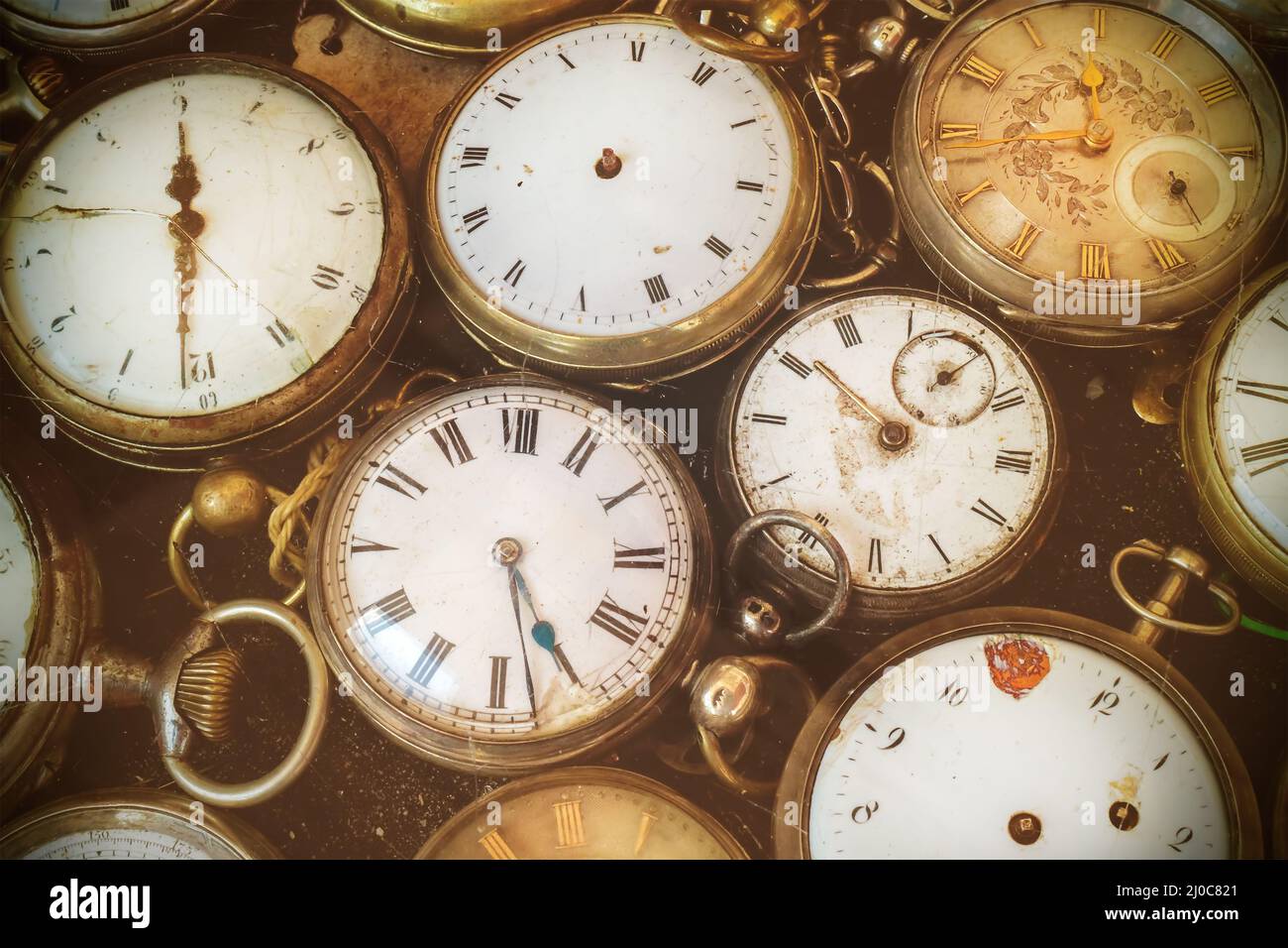 Retro styled image of old scratched and run down pocket watches Stock Photo Alamy