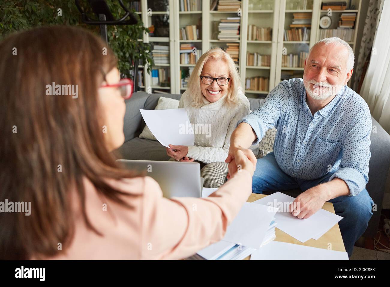 Financial advisors and seniors shake hands when signing a contract or as a thank you Stock Photo