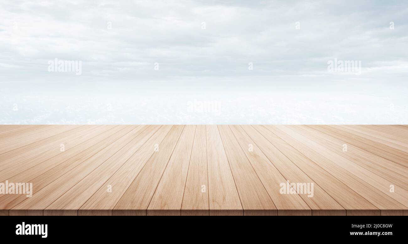 Empty wood table top under morning cloud and grey sky background for display or montage product Stock Photo