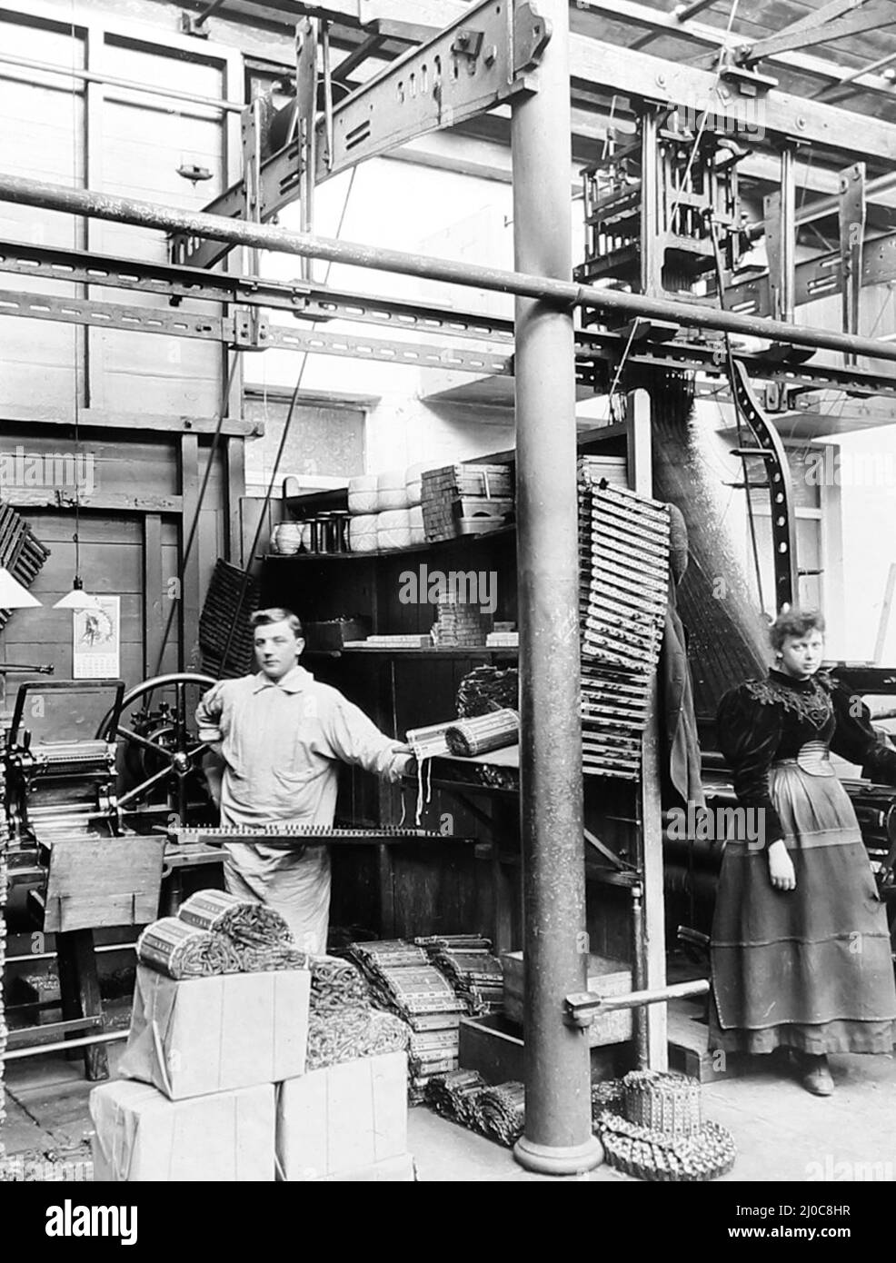 Card cutting machine in a woollen mill in Bradford, Yorkshire, late