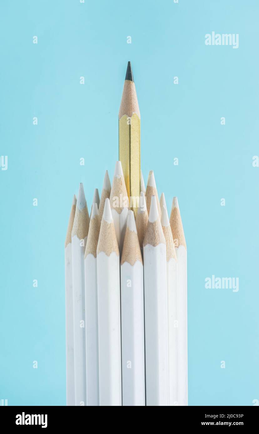Business concept - lot of white pencils and one color pencil stand on ...