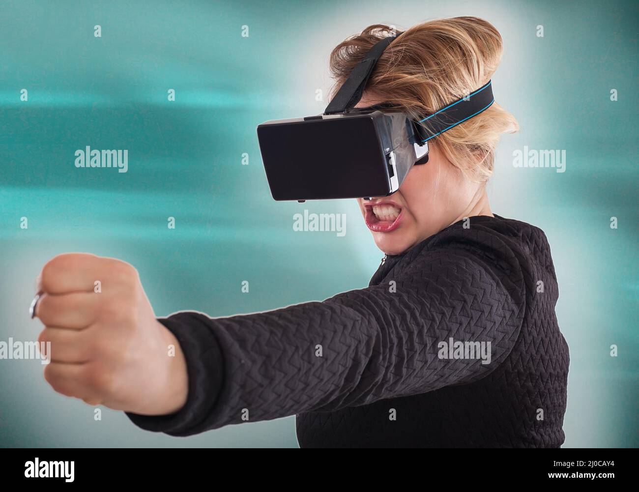 Woman play game with virtual reality device mask. Studio shoot Stock