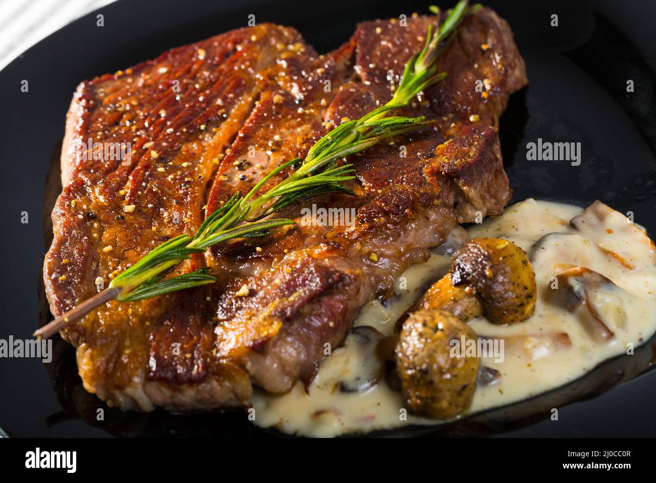 Beef entrecote with mushroom sauce is tasty dish Stock Photo Alamy