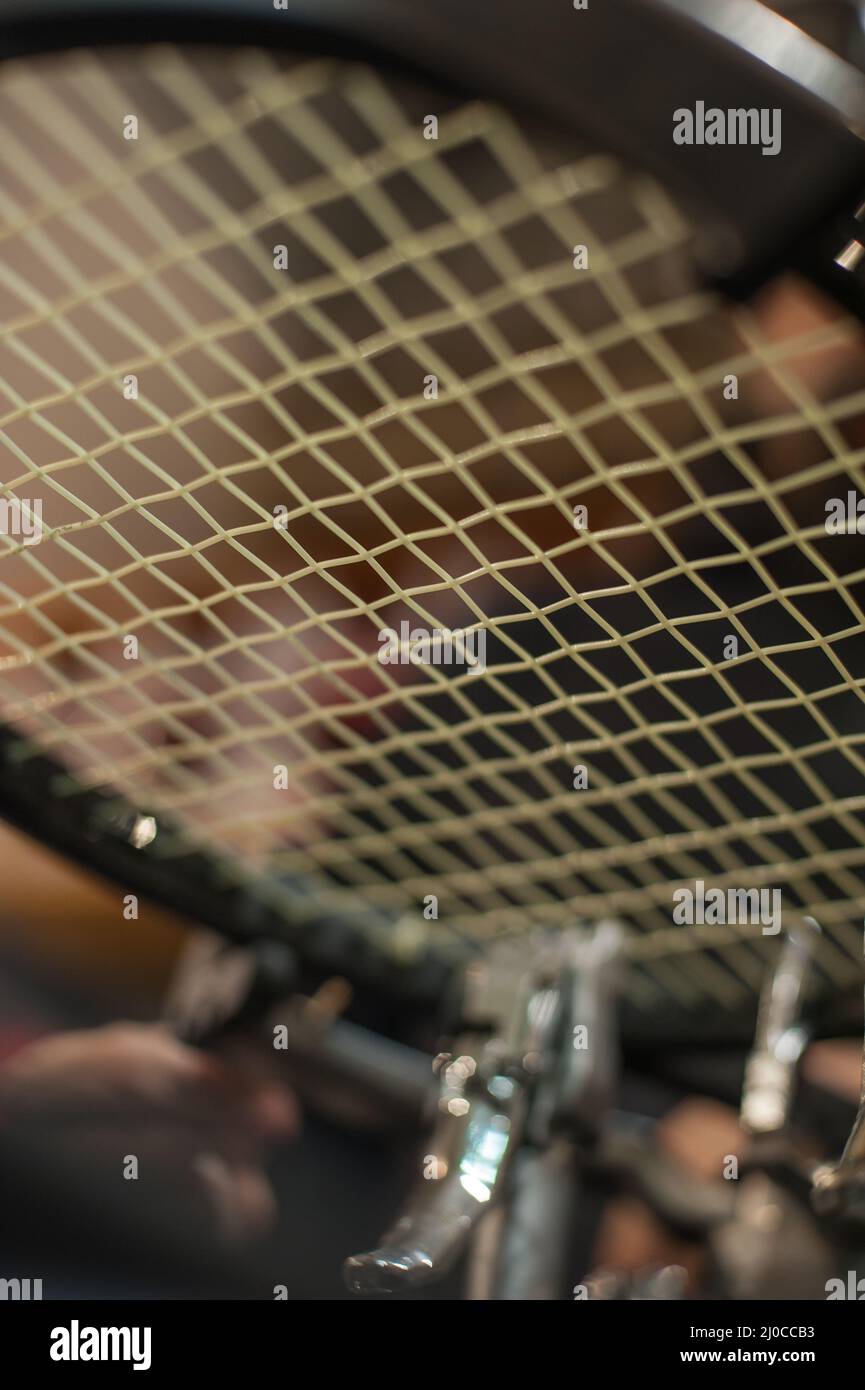 Racket stringing. Detail of tennis racket in the stringing machine