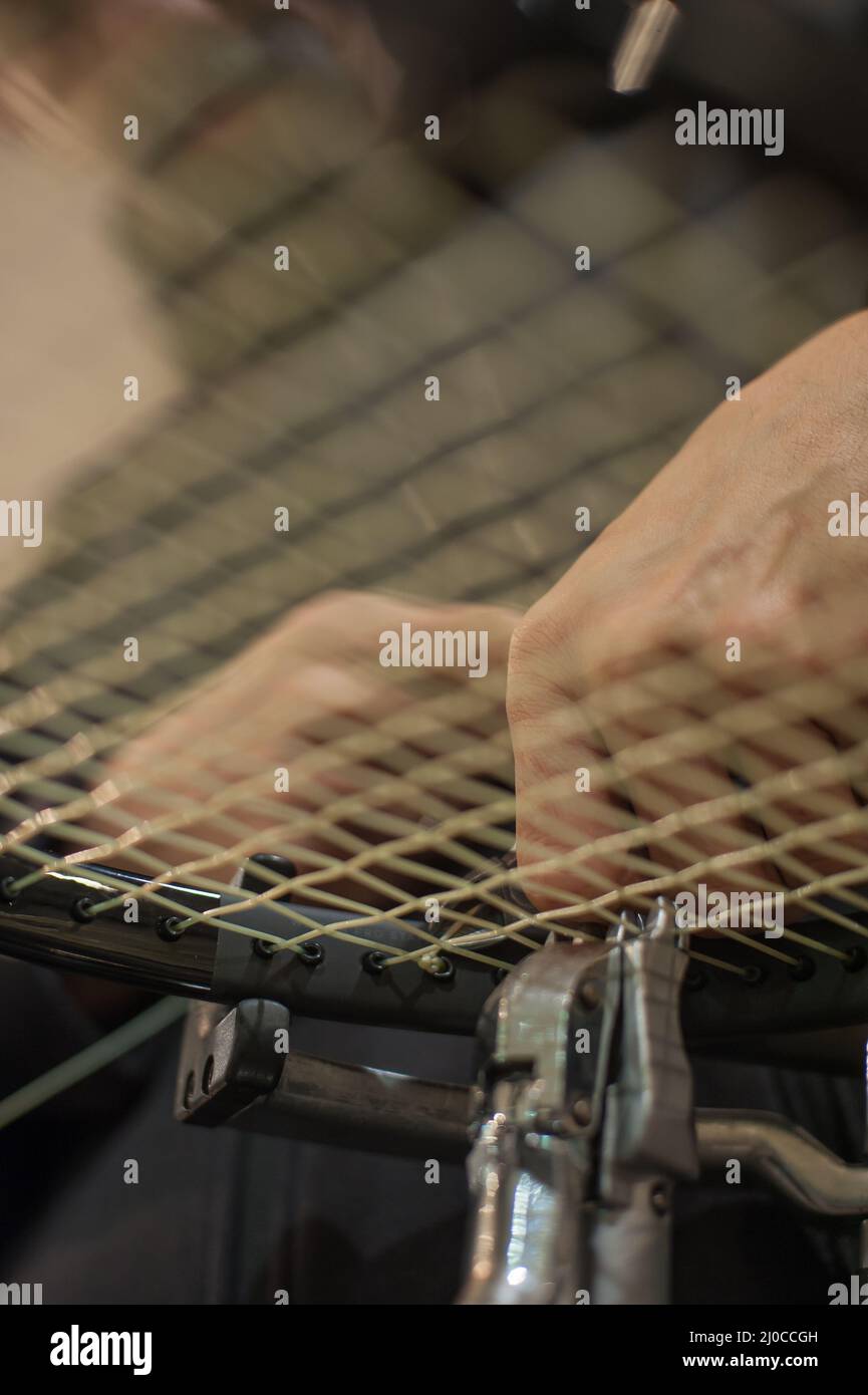 Racket stringing. Detail of tennis racket in the stringing machine