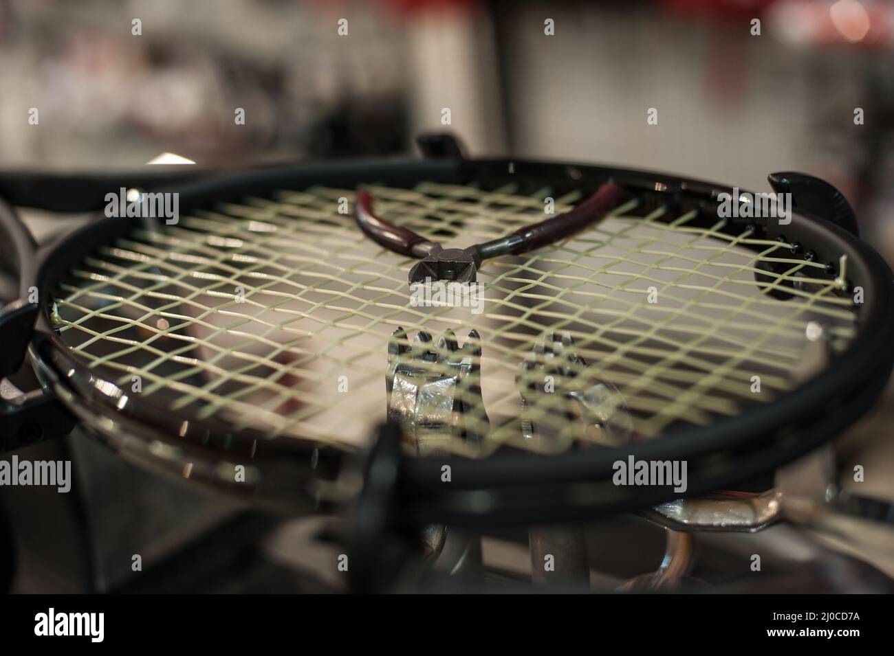Racket stringing. Detail of tennis racket in the stringing machine