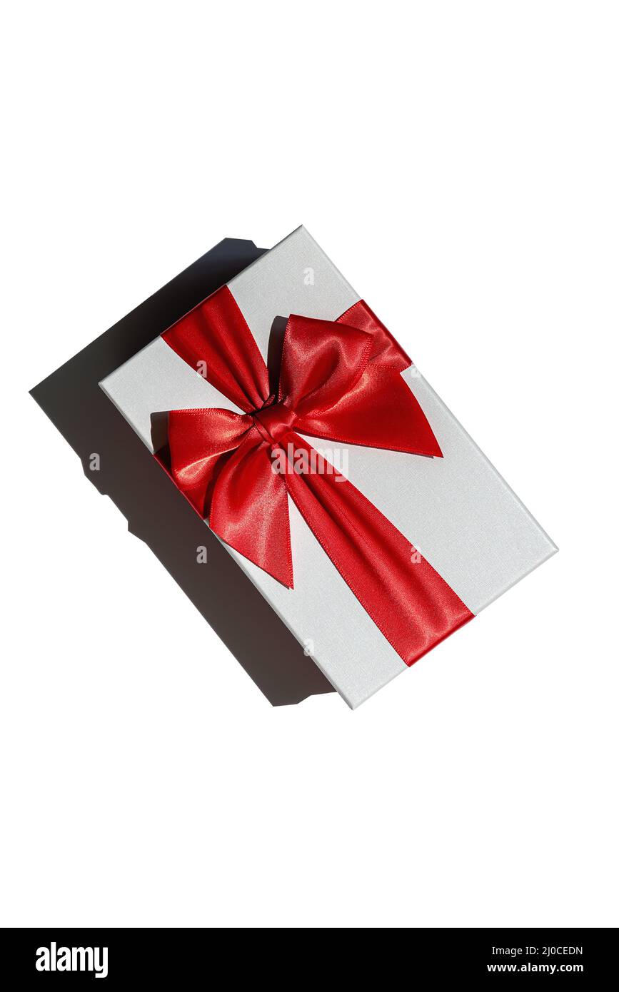 Square closed gift box made of white paper, tied up with wide