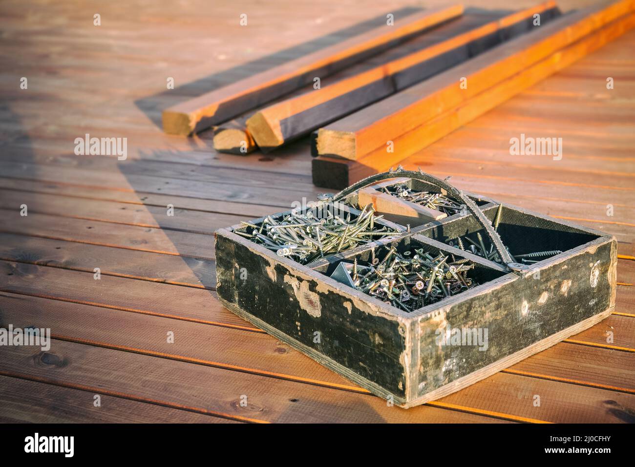 Wooden box with screws Stock Photo