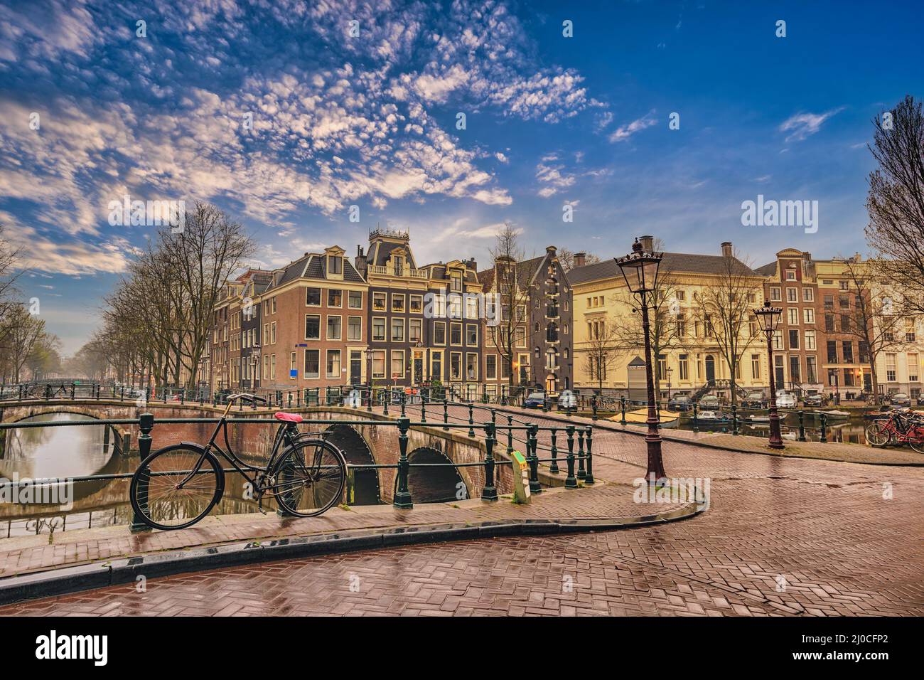 Amsterdam Netherlands, city skyline of Dutch house at canal waterfront Stock Photo