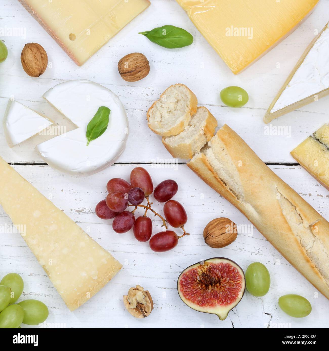 Cheese plate swiss cheese plate bread camembert square from top Stock