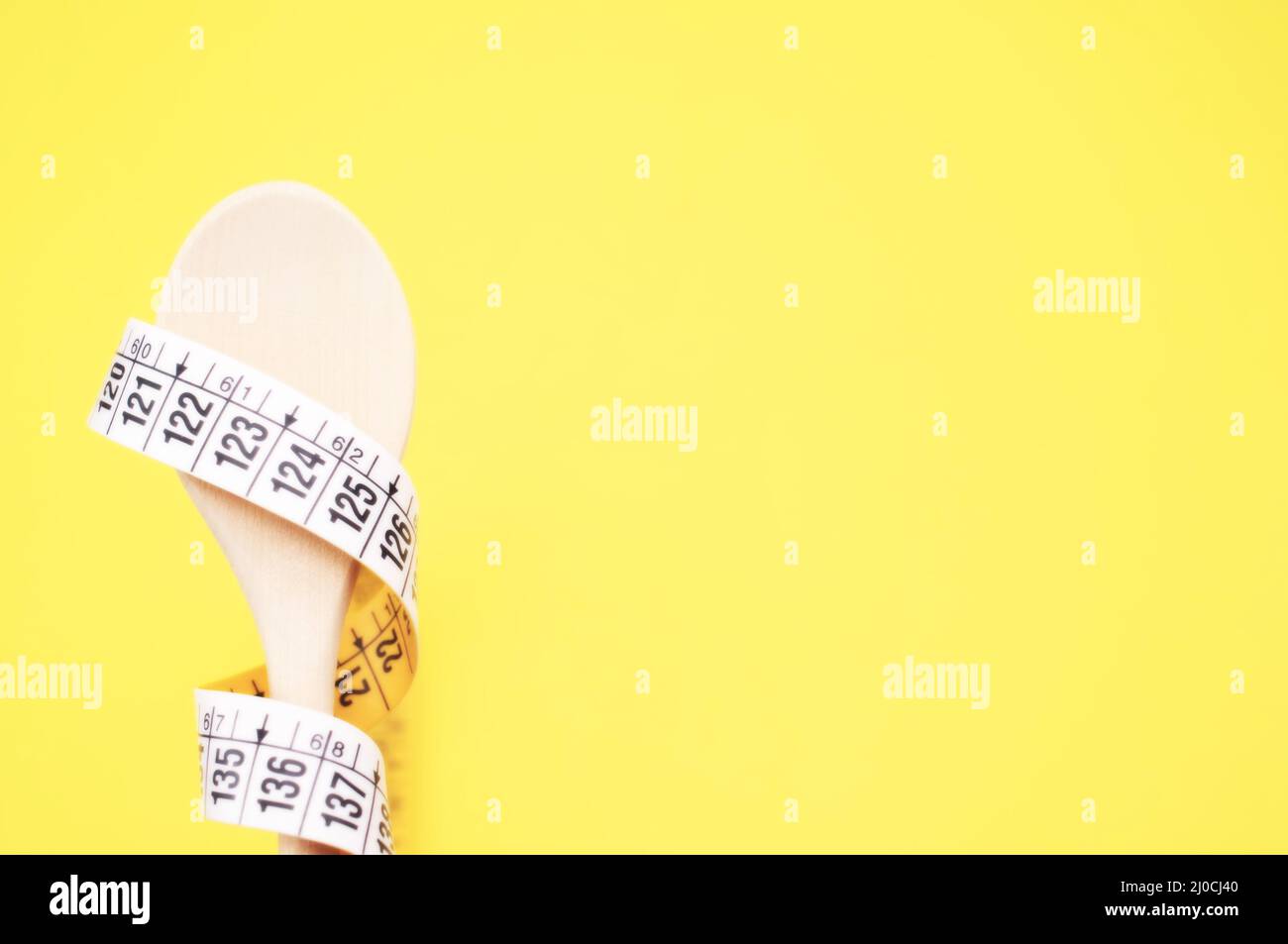 Diet and healthy eating concept - tailor flexible ruler and cutlery ...