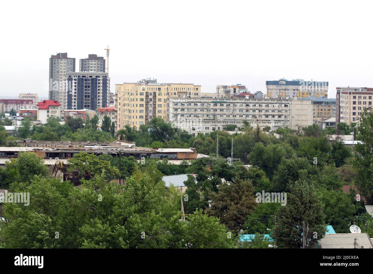 Multistory buildings and idle factories in Bishkek, Kyrgyzstan Stock Photo