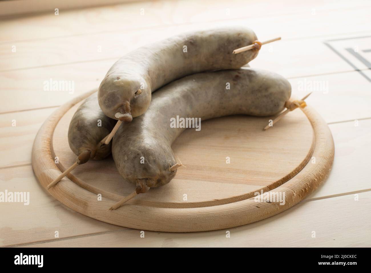 Tripe sausages, liver sausage served on a wooden board Stock Photo