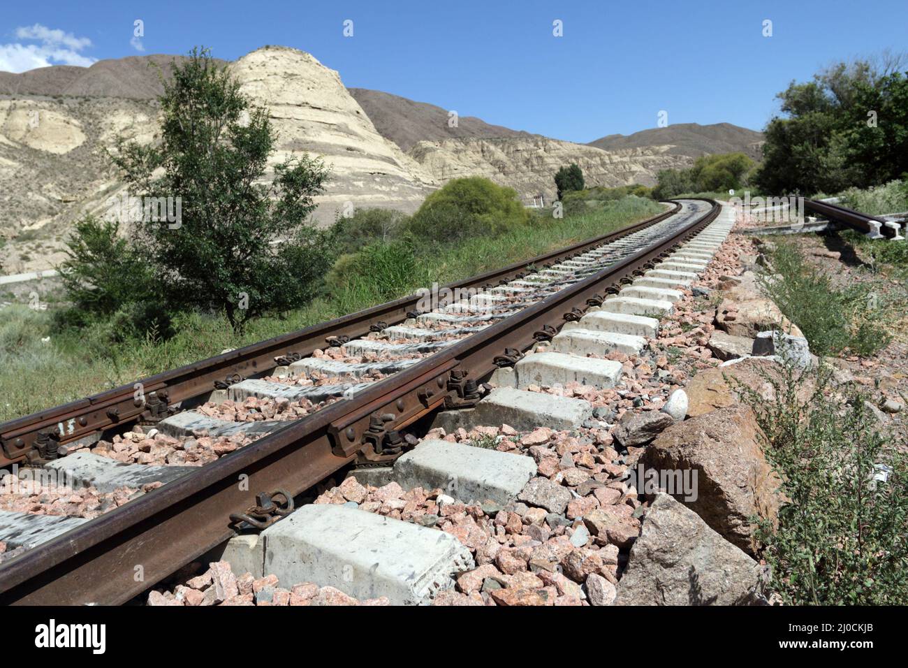 Railroad track near Tokmak, Kyrgyzstan Stock Photo