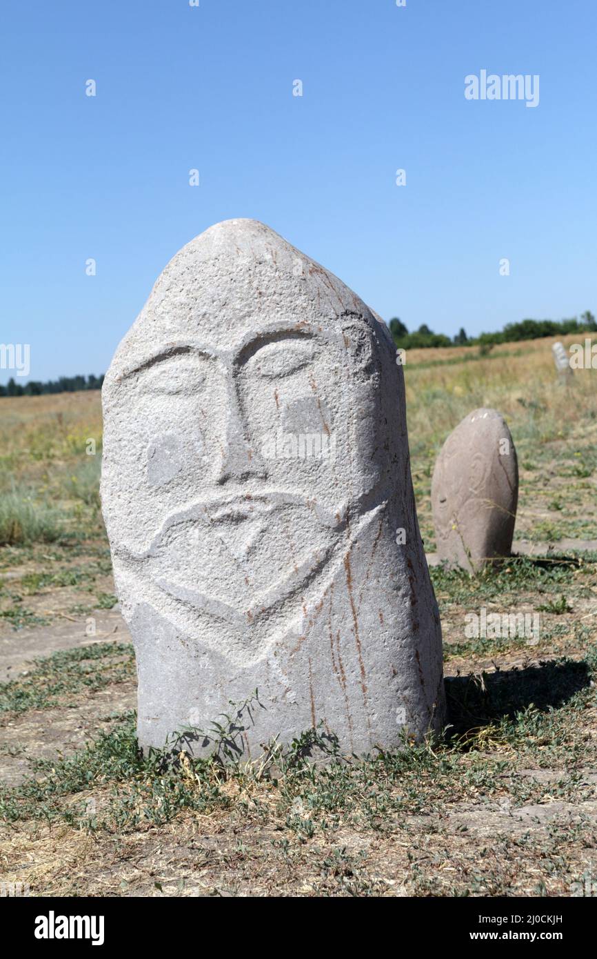 Medieval stone sculpture (Balbal) at Burana Tower, Tokmak, Kyrgyzstan Stock Photo