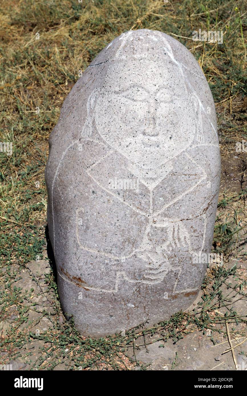 Medieval stone sculptur (Balbal) at Burana Tower, Tokmak, Kyrgyzstan Stock Photo