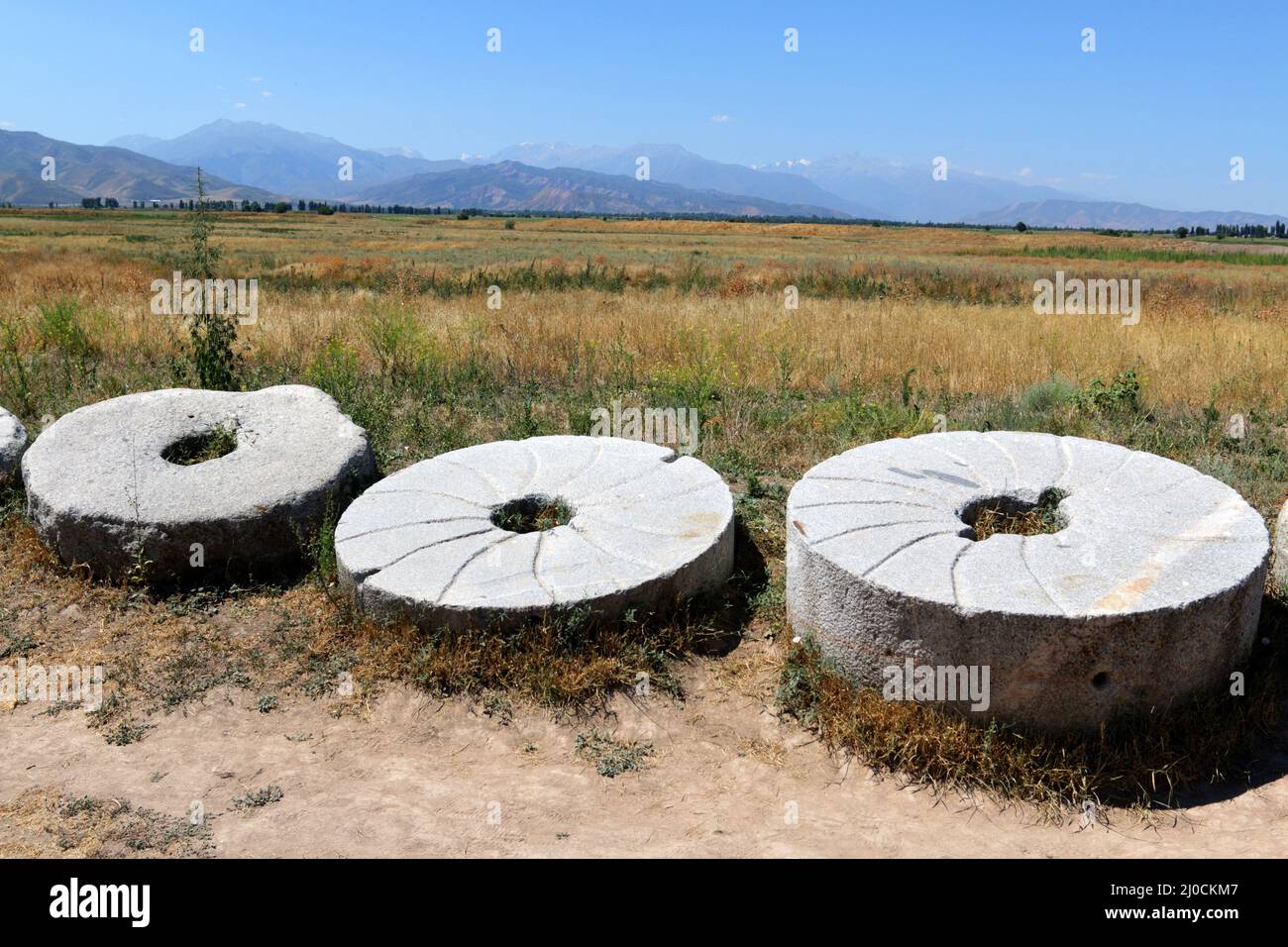 Millstones at Burana Tower, Tokmak, Kyrgyzystan Stock Photo