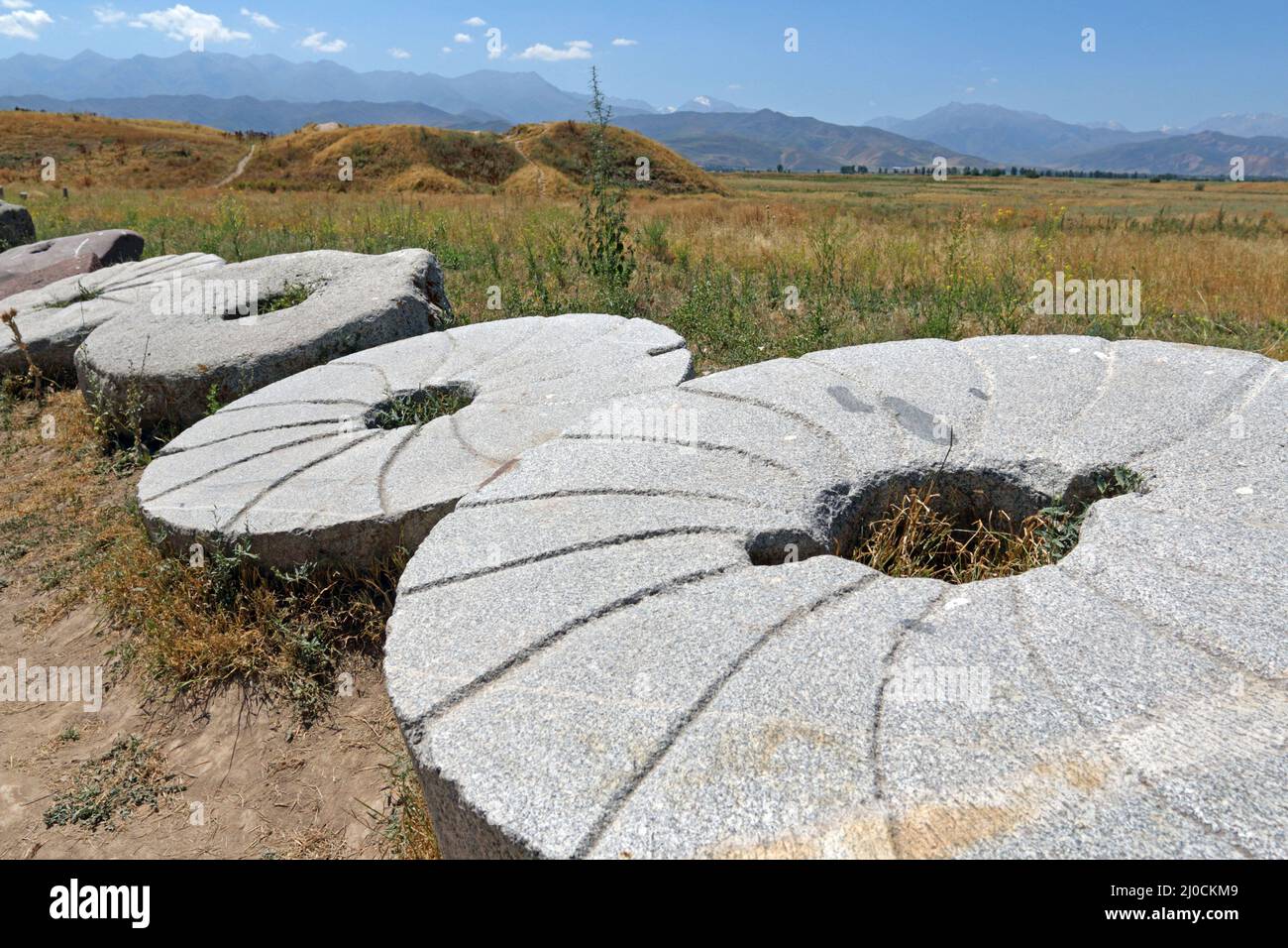 Millstones at Burana Tower, Tokmak, Kyrgyzystan Stock Photo