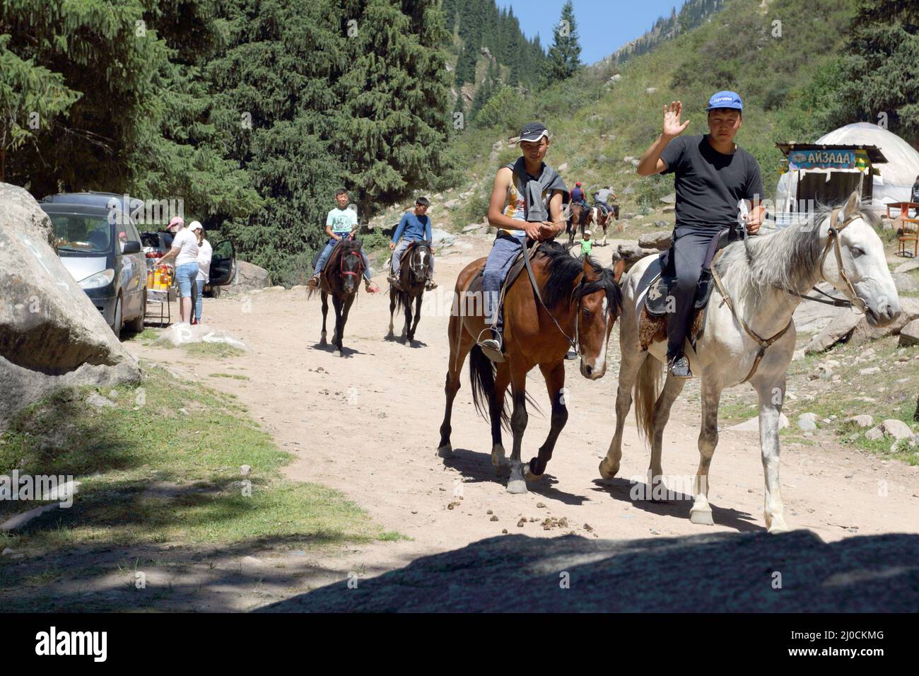 Horse riders, Grigorievka gorge, Kungei Alatoo Mountains, Kyrgyzstan Stock Photo