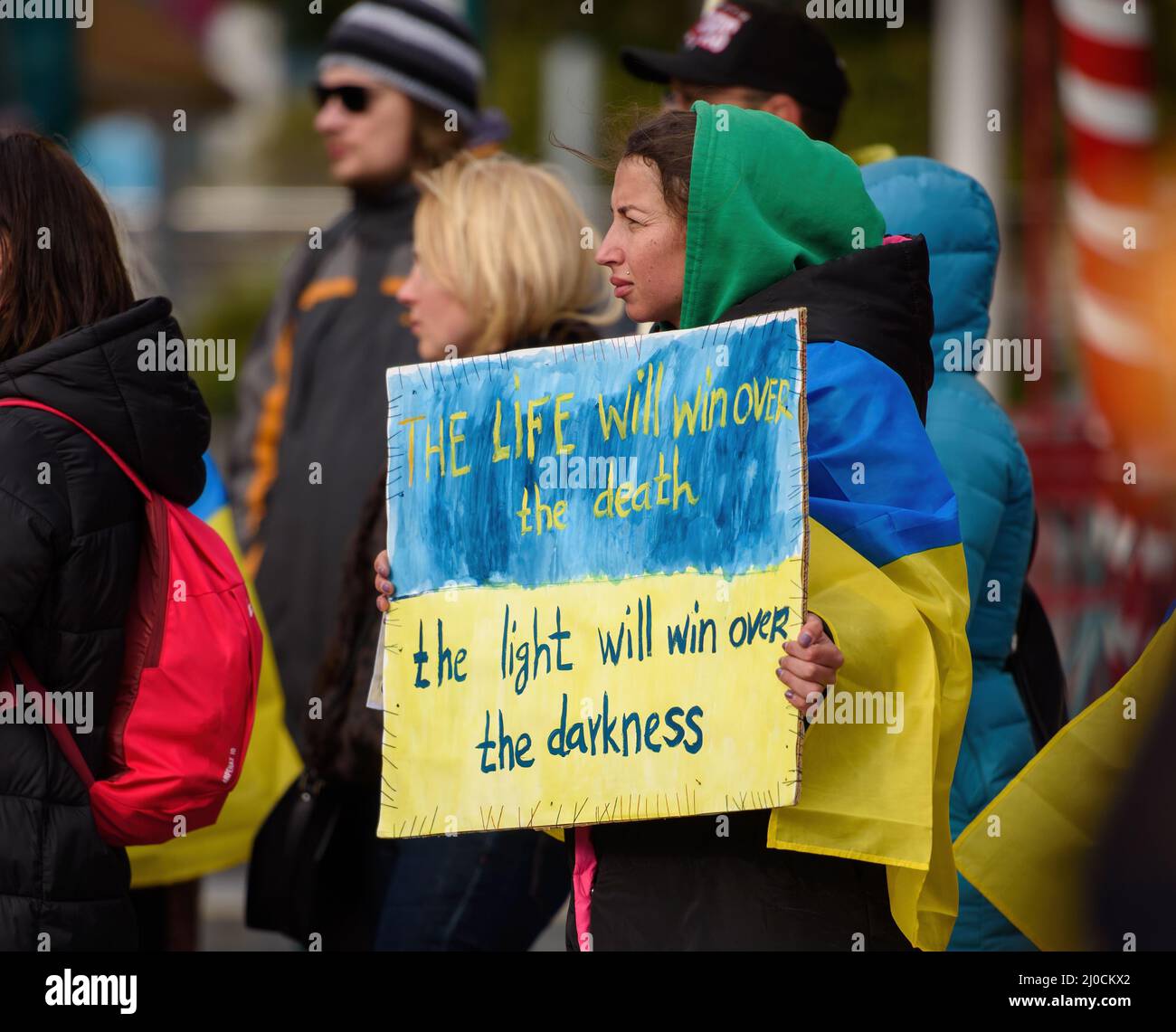 LIMASSOL, CYPRUS - MARCH 13, 2022: Female activist holding sign on a rally in support of Ukraine Stock Photo