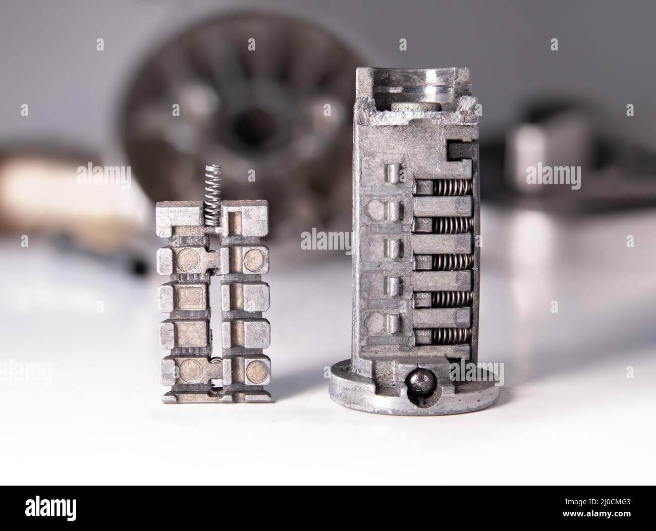 Broken cylinder of single door look with deadbolt, close up. Damaged