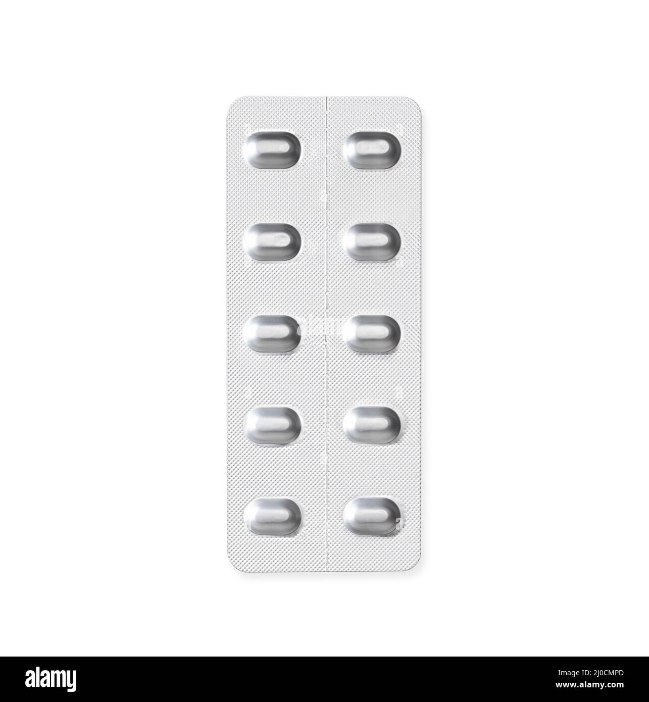 Isolated tablet pills in blister package or pill pack. Silver aluminium 10-pack pill dispenser used for drugs, medication and vitamins. Stock Photo