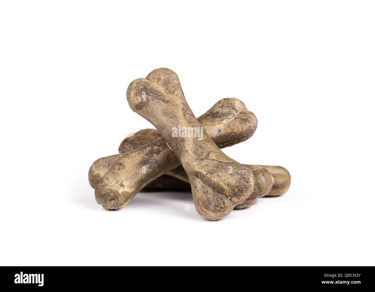 Pile of dog chew bones with mint. Multiple vegetarian dog treat sticks in bone shape for stronger teeth, better gums and breath. Dental health treats Stock Photo