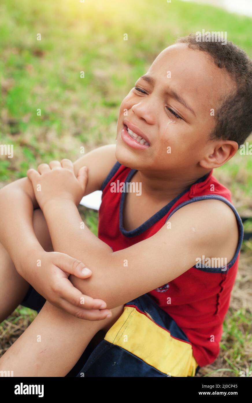 Portrait of little boy crying with tears on cheeks Stock Photo