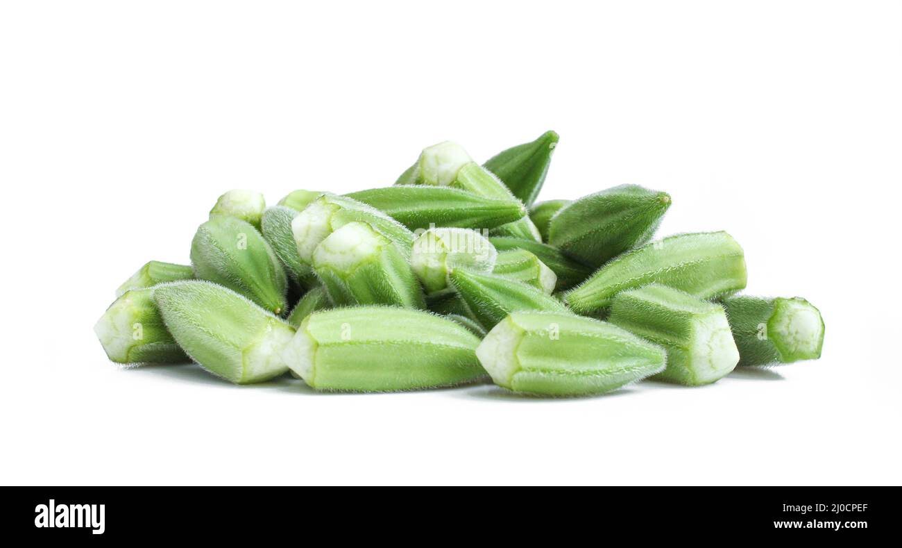 Group of green okra seeds isolated on white background. Fresh raw