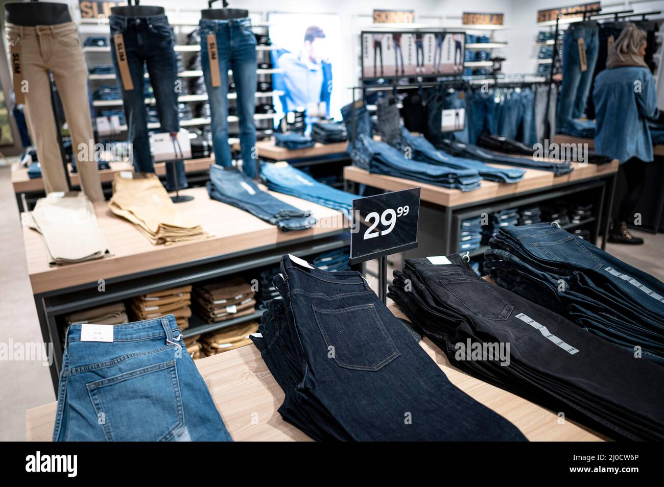 Berlin, Germany. 02nd Mar, 2022. Various jeans are lying in the men's  department in the C&A clothing store in a shopping center in Berlin-Marzahn.  Credit: Fabian Sommer/dpa/Alamy Live News Stock Photo -