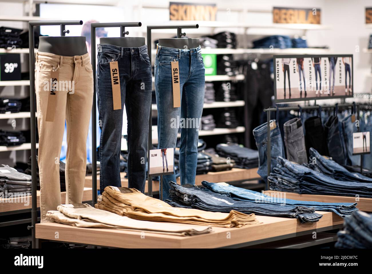 Berlin, Germany. 02nd Mar, 2022. Various jeans of the Slim category are in  the men's department in the C&A clothing store in a shopping center in  Berlin-Marzahn. Credit: Fabian Sommer/dpa/Alamy Live News
