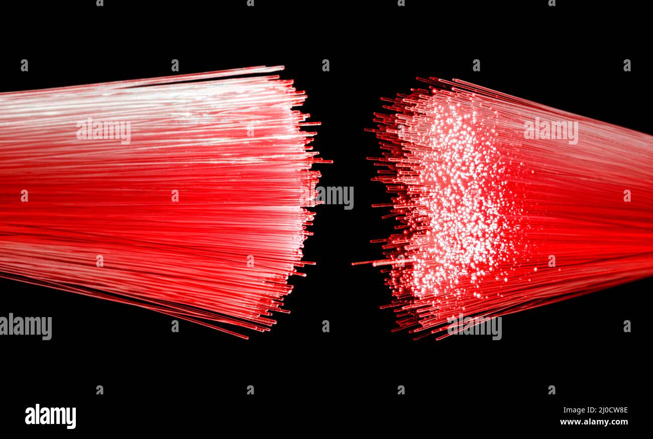 Vibrant illuminated optical fibers closeup in black back Stock Photo