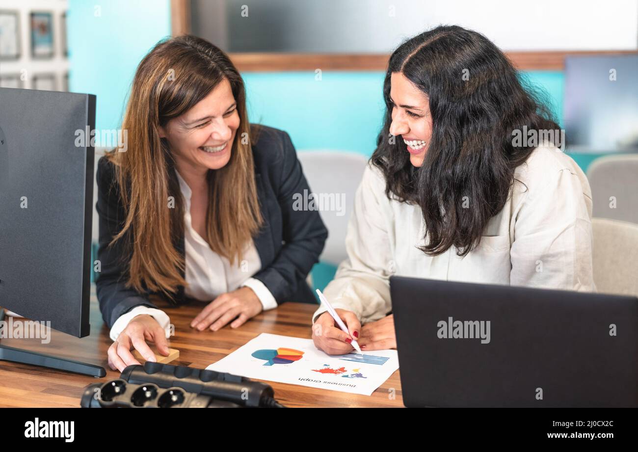 Business women working together in co-working creative space Stock Photo