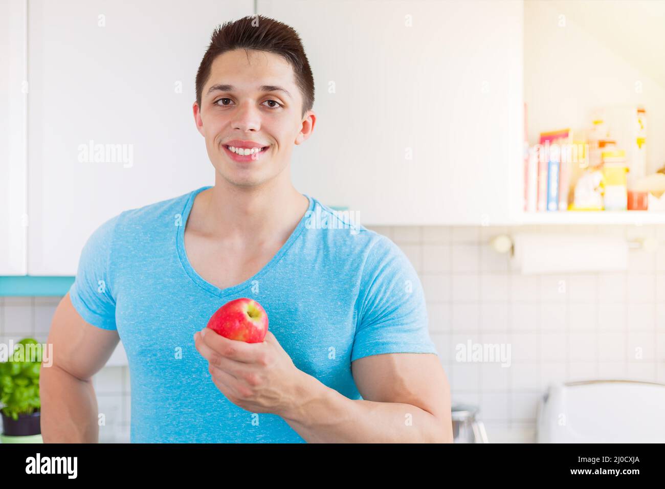 Apple fruit healthy diet young man food text free space Stock Photo - Alamy