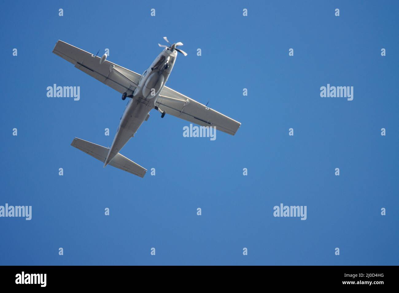 a close up of a propeller plane in the blue sky Stock Photo - Alamy